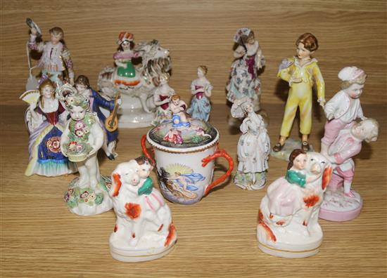 A Derby putto and a collection of Staffordshire and Continental figures (faults)
